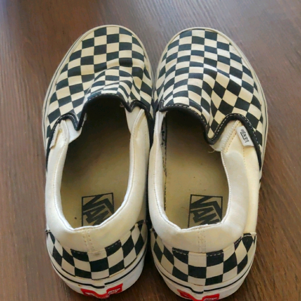 Black checker slip on Vans